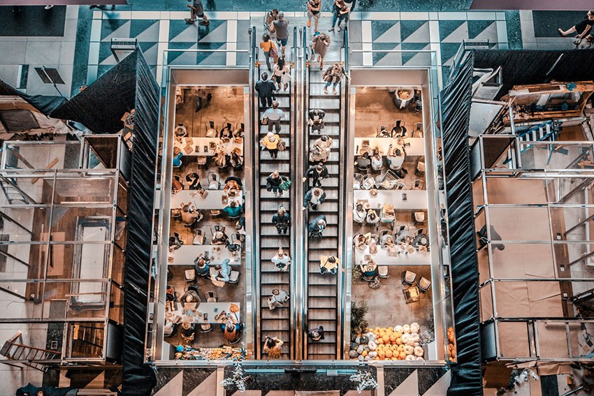 People in mall restaurant browsing for content