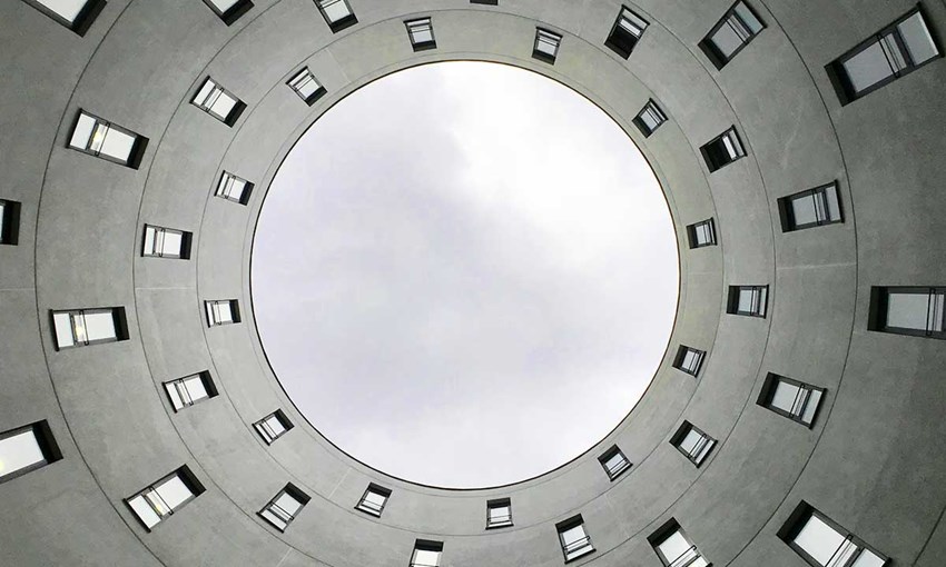 Image depicting a circular building complex with windows. Concept process cycle